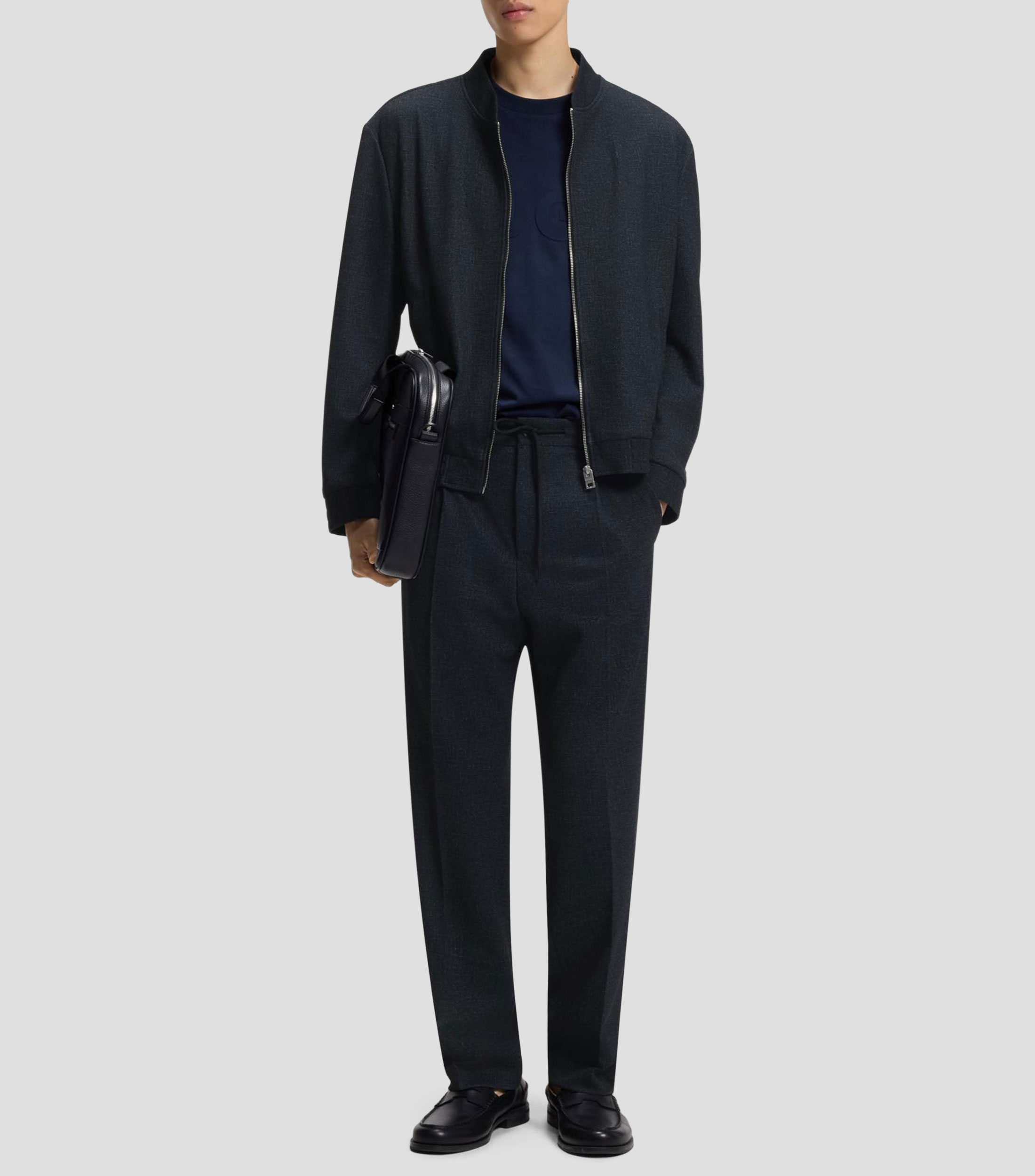 Pantalones regular fit en tejido elástico con microestampado Hombre